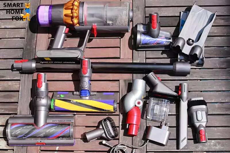 All the accessories for the Dyson V15 are laid out on a table.